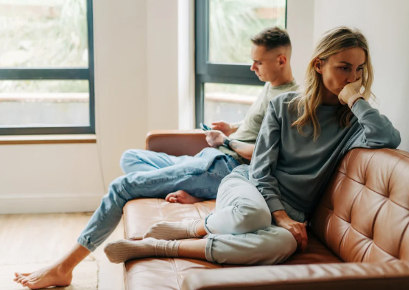 couple frustrated talking about money